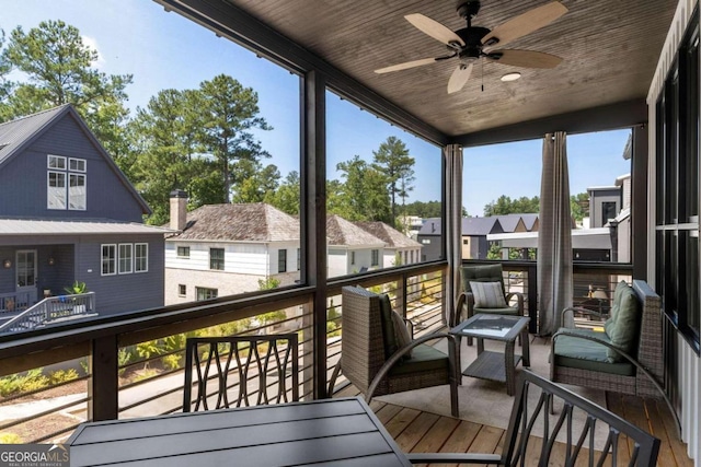 exterior space featuring a ceiling fan