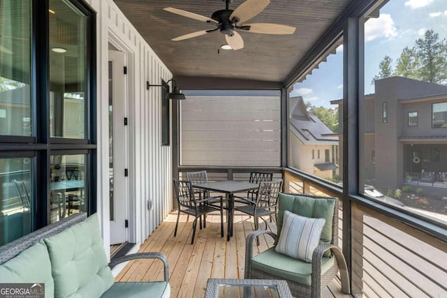 sunroom / solarium with wood ceiling and ceiling fan