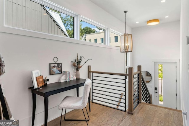 entryway featuring recessed lighting, an inviting chandelier, and wood finished floors