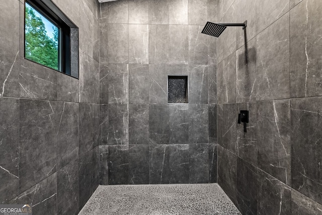 bathroom with tiled shower