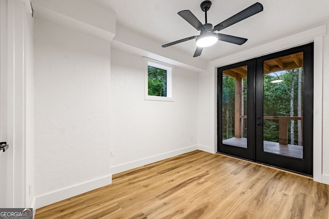 entryway featuring light wood-type flooring, french doors, and ceiling fan