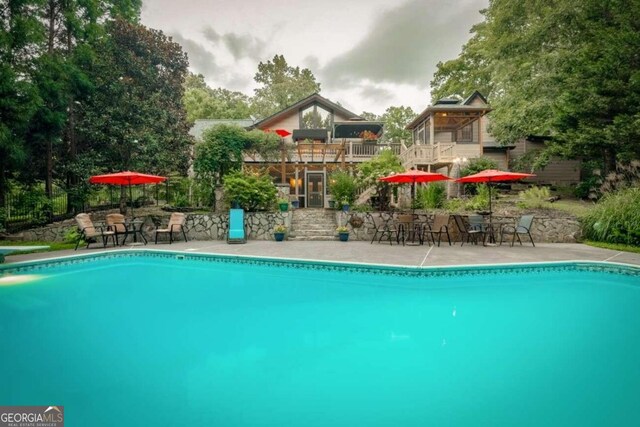 view of pool featuring a patio