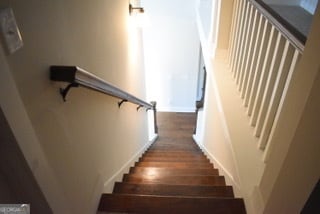 stairway with wood-type flooring