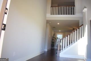 staircase with a high ceiling