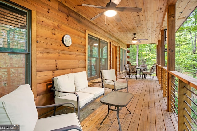 wooden deck with outdoor lounge area