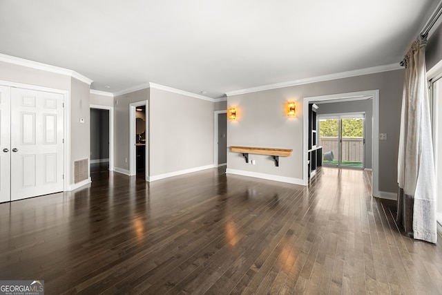 unfurnished living room featuring dark wood-type flooring and ornamental molding