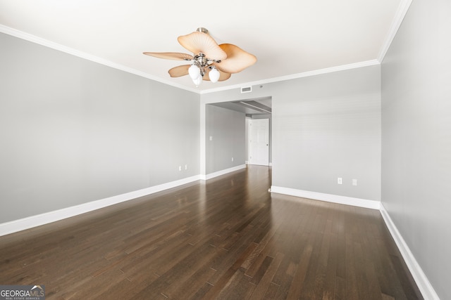 spare room with ceiling fan, dark hardwood / wood-style floors, and crown molding