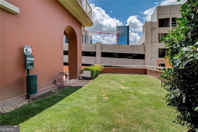 view of yard with a balcony