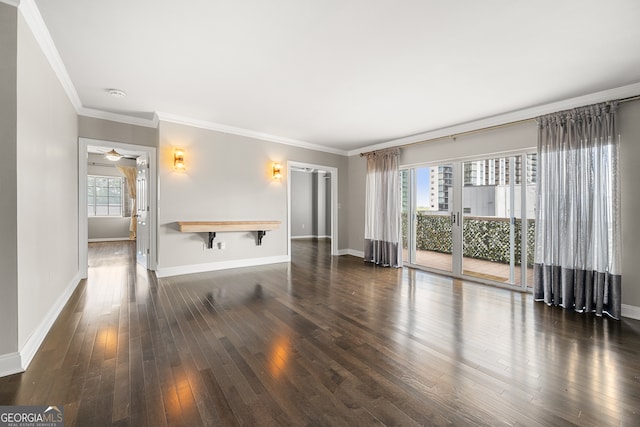 unfurnished living room with ornamental molding, plenty of natural light, and dark hardwood / wood-style floors