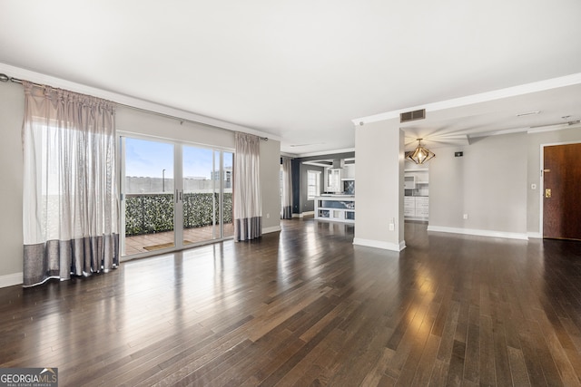 unfurnished living room with dark hardwood / wood-style flooring