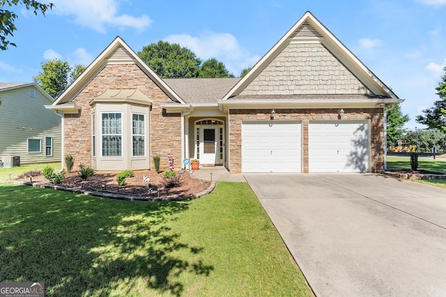 view of front of property featuring a front yard, central air condition unit, and a garage