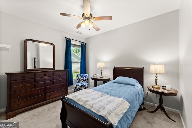 carpeted bedroom featuring ceiling fan