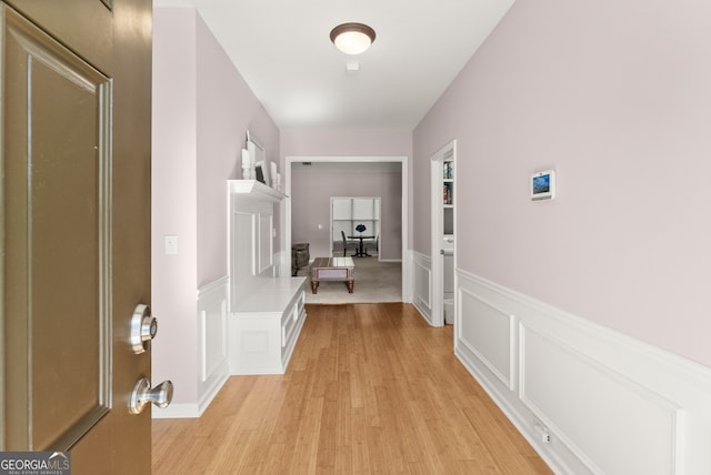 hallway with light wood-type flooring