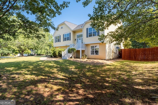 bi-level home with a front lawn