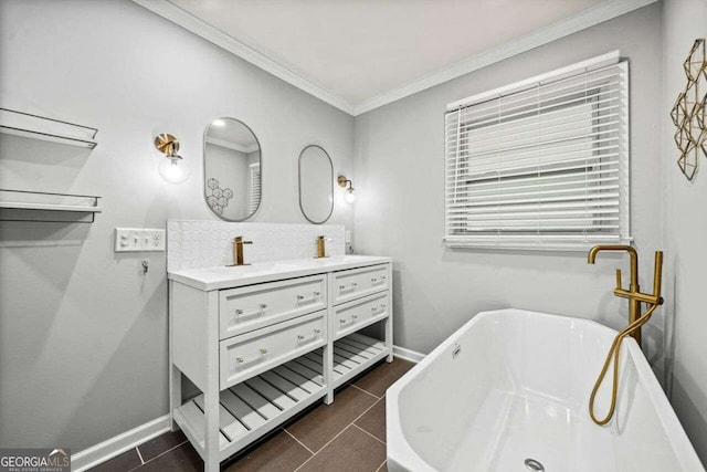 bathroom featuring tile patterned flooring, vanity, ornamental molding, and a bathing tub