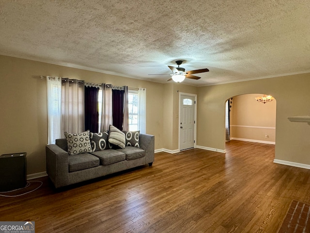 unfurnished living room with wood-type flooring, ceiling fan, and a textured ceiling