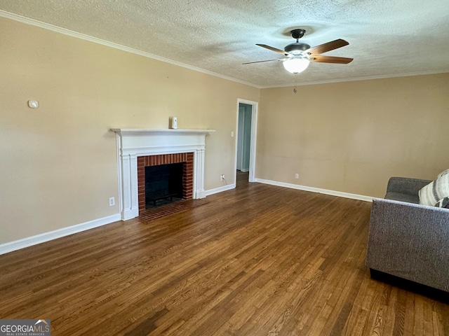 unfurnished living room featuring a textured ceiling, ceiling fan, hardwood / wood-style flooring, and a fireplace