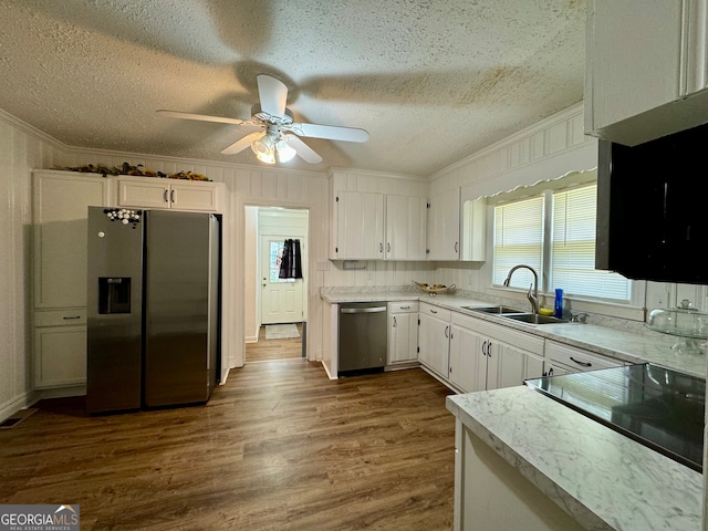 kitchen with white cabinets, ceiling fan, stainless steel appliances, and dark hardwood / wood-style floors