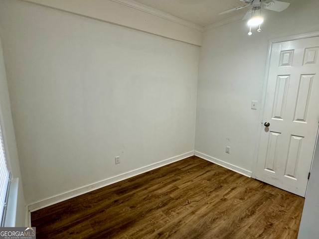 empty room featuring ceiling fan, dark hardwood / wood-style floors, and ornamental molding