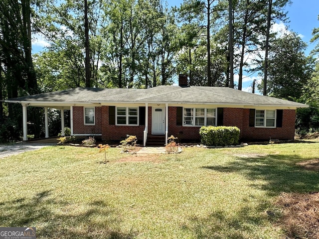 ranch-style house featuring a carport and a front lawn