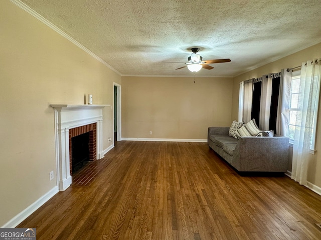 unfurnished living room with a textured ceiling, ceiling fan, hardwood / wood-style floors, and a fireplace