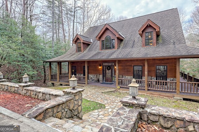 view of yard featuring a deck with water view