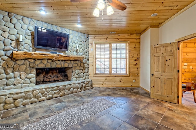 unfurnished living room with a fireplace, wooden ceiling, and ceiling fan