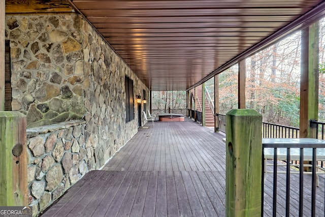 deck with a hot tub