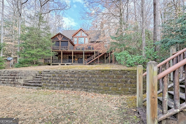 rear view of house with a deck