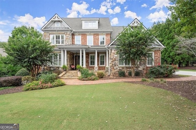 craftsman-style home featuring a front lawn