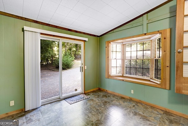 tiled empty room with vaulted ceiling