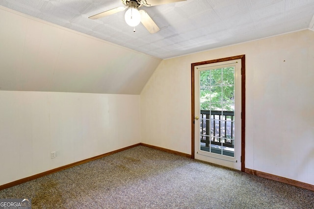 bonus room featuring lofted ceiling, carpet, and ceiling fan