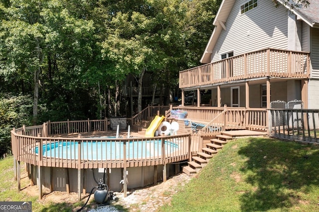 view of swimming pool featuring a deck