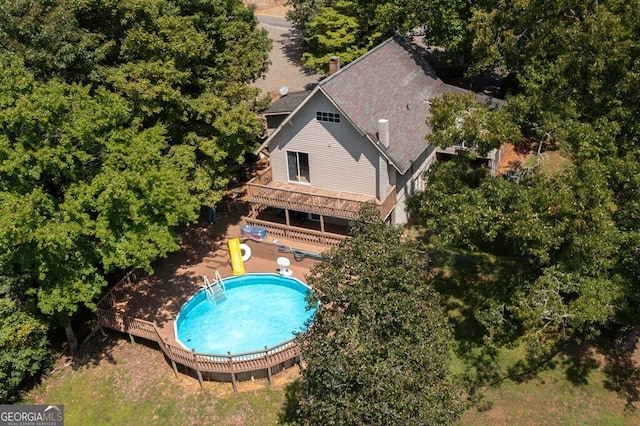 view of pool with a patio and a wooden deck