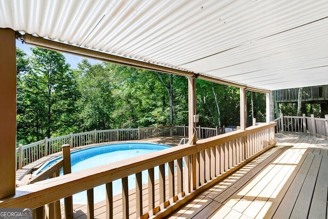 deck with a fenced in pool