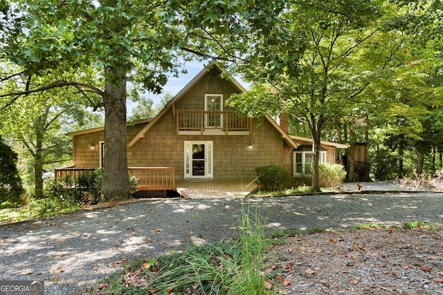 view of front facade with a wooden deck