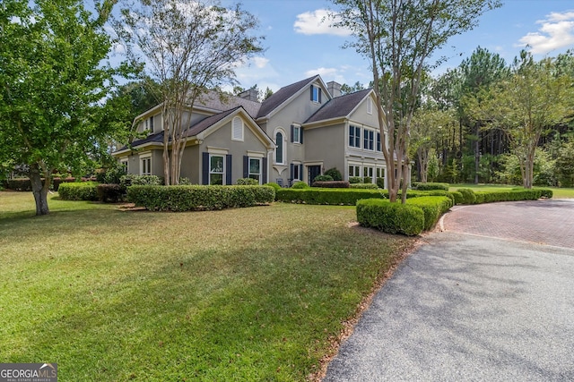 view of property featuring a front yard