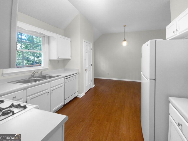 kitchen with white cabinetry, white appliances, sink, dark wood-type flooring, and lofted ceiling