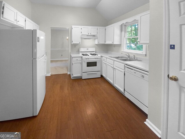 kitchen featuring white appliances, vaulted ceiling, dark hardwood / wood-style flooring, and sink