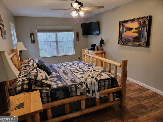 bedroom with ceiling fan and dark hardwood / wood-style floors