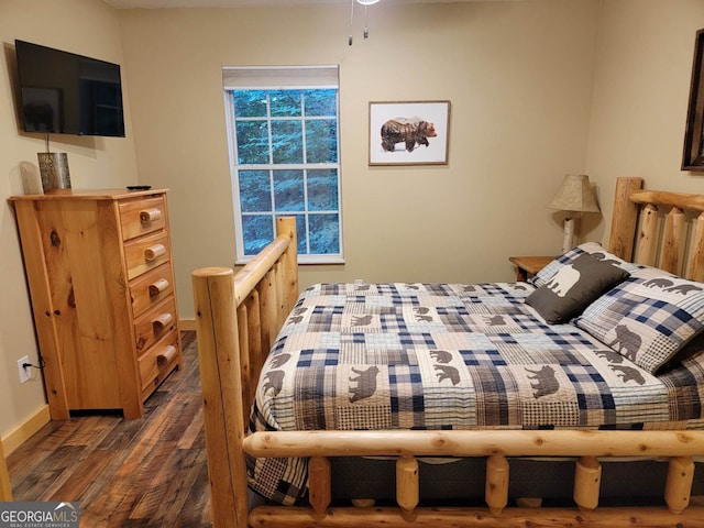 bedroom featuring dark hardwood / wood-style floors