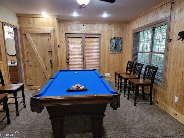 game room with wood walls, billiards, ceiling fan, and carpet floors