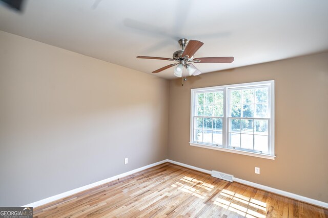 spare room with ceiling fan and light hardwood / wood-style floors