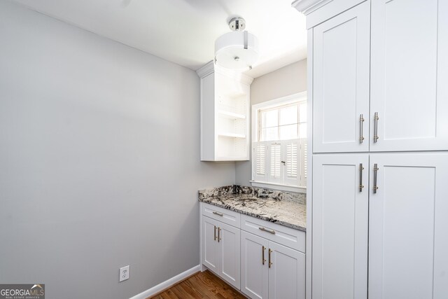 bathroom featuring vanity and wood-type flooring