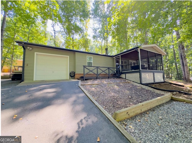 view of front of property featuring a sunroom