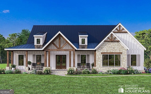 modern farmhouse style home with covered porch and a front lawn