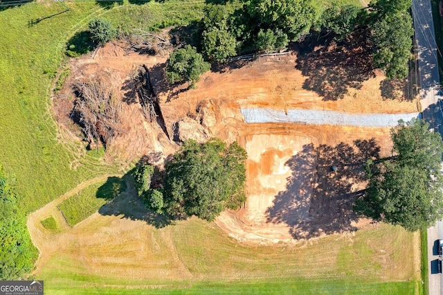 birds eye view of property with a rural view