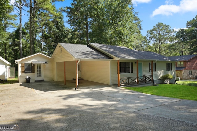 ranch-style house with a carport and a front yard