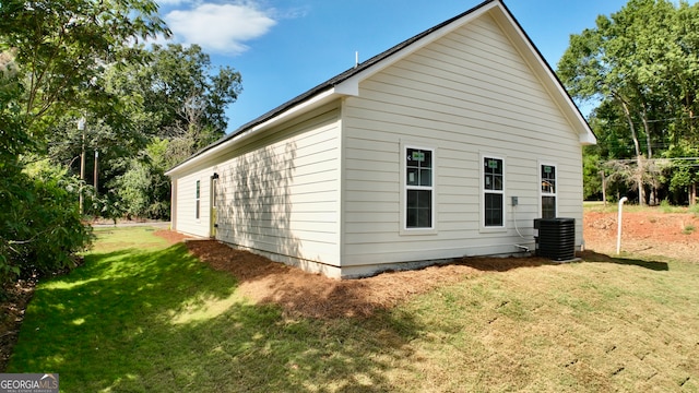 view of home's exterior with a yard