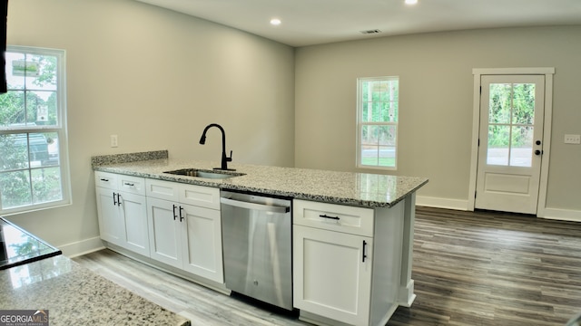 kitchen with dishwasher, a healthy amount of sunlight, sink, and hardwood / wood-style floors